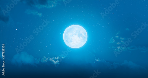 Night sky with full moon in the clouds at sunset "Elements of this image furnished by NASA