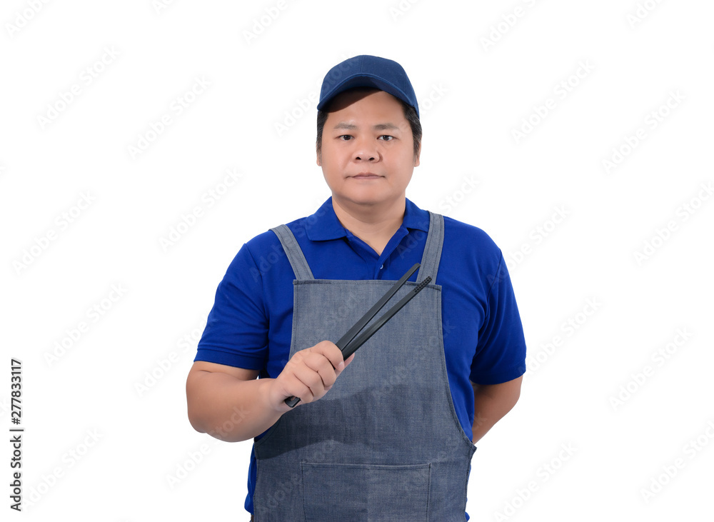 asian Waiter in blue shirt with apron hand holding Tongs isolated on white asian Waiter in blue shirt with apron hand holding Tongs isolated on white