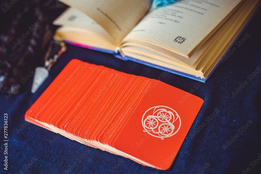 Mystical atmosphere of tarot card on the table, esoteric concept, fortune telling and predictions Mystical atmosphere of tarot card on the table, esoteric concept, fortune telling and predictions