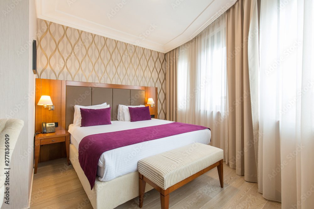 Luxury double bed hotel bedroom interior