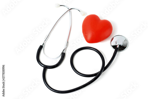 Stethoscope and red heart close up on white background