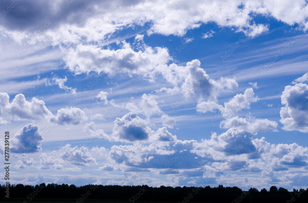 beautiful clouds on the bright blue sky