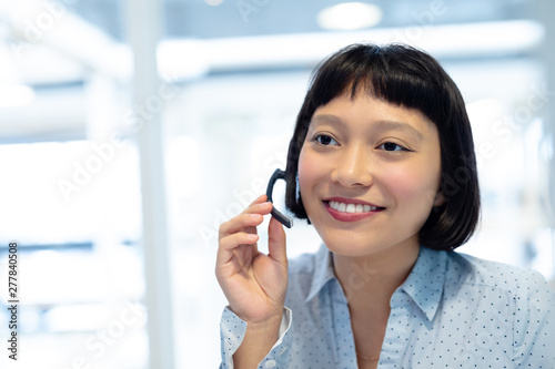 Female customer service executive talking on headset
