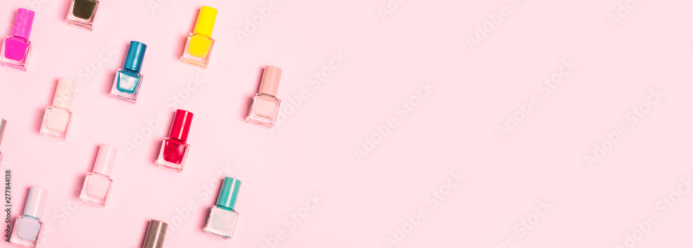 Colorful Nail polish bottles pattern background. Close up. - obrazy, fototapety, plakaty 
