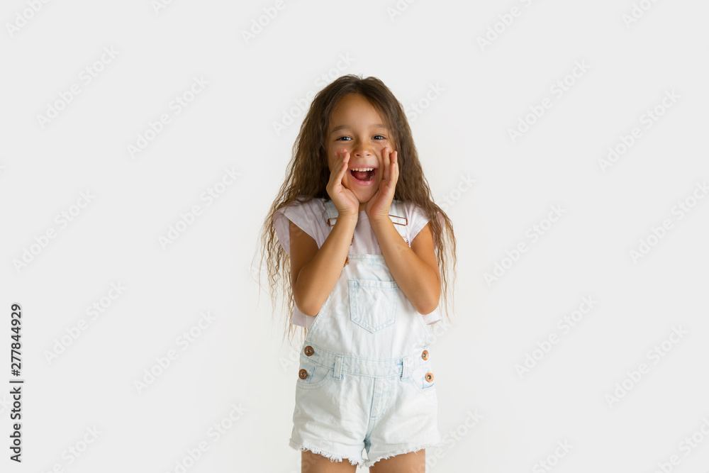 Beautiful female half-length portrait isolated on white studio background. Little emotional asian girl wearing white. Facial expression, human emotions, advertising, sales concept. Screaming happy. Beautiful female half-length portrait isolated on white studio background. Little emotional asian girl wearing white. Facial expression, human emotions, advertising, sales concept. Screaming happy.