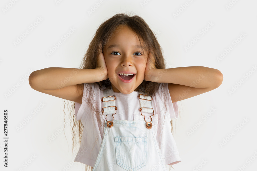 Beautiful female half-length portrait isolated on white studio background. Little emotional asian girl wearing white. Facial expression, human emotions, advertising concept. Feeling crazy happy. Beautiful female half-length portrait isolated on white studio background. Little emotional asian girl wearing white. Facial expression, human emotions, advertising concept. Feeling crazy happy.