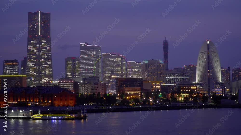 Night view of Yokohama Cityscape and bay at Minato Mirai waterfront district from Yokohama. Minato Mirai 21 is a seaside urban area in central Yokohama whose name means Night view of Yokohama Cityscape and bay at Minato Mirai waterfront district from Yokohama. Minato Mirai 21 is a seaside urban area in central Yokohama whose name means
