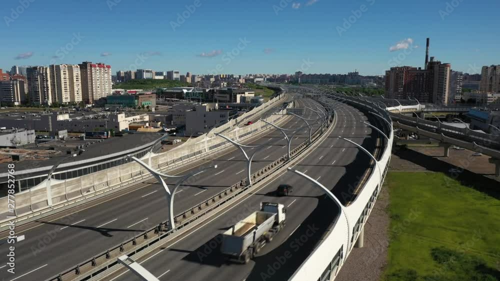 Aerial View of Cars Driving on Bridge With Buildings in Background in Saint Petersburg Russia Aerial View of Cars Driving on Bridge With Buildings in Background in Saint Petersburg Russia