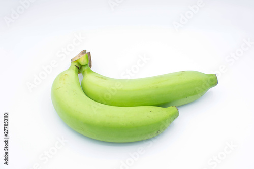 Green bananas on white background.
