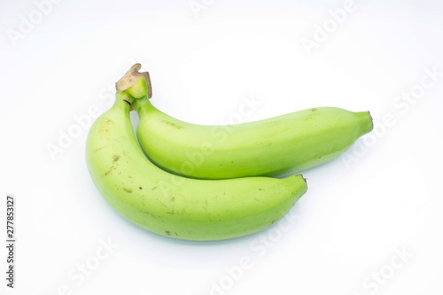 Green bananas on white background.