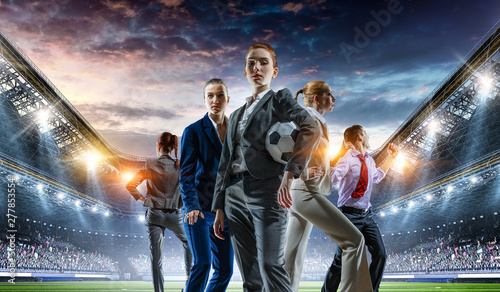 Business team on football stadium. Mixed media © Sergey Nivens