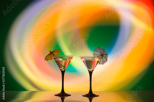 colourful cocktail on the club light background.