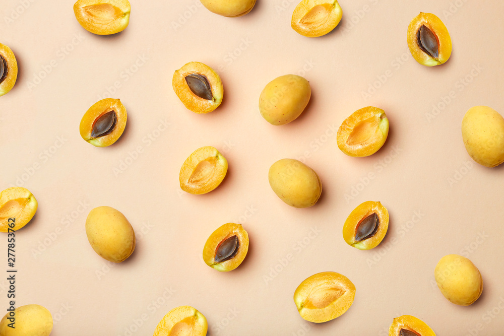 Apricots on a colored background. Pattern of a apricots. Apricots isolated, flat lay, top view Apricots on a colored background. Pattern of a apricots. Apricots isolated, flat lay, top view