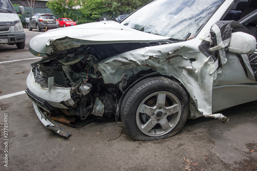 a completely wrecked car after a serious accident,.ruined car