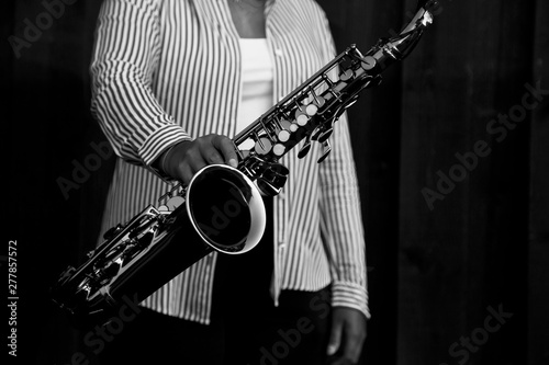 woman playing the saxophone