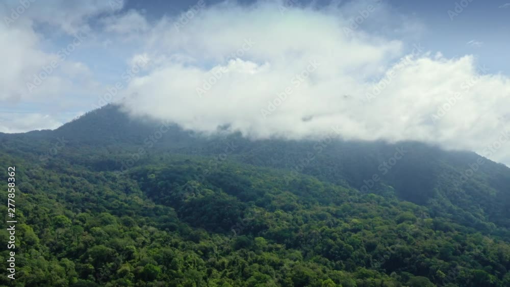 Aerial: Flying over mountains with tropical forest in Jatiluwih, Bali Aerial: Flying over mountains with tropical forest in Jatiluwih, Bali