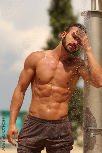 Beach, Abs , Guy. Man. Model. Shower, wash Male. Beach, Resort. Summer, Sexy, sexually, resort. Sand, Fitness. Health. Body, abs, chest, torso, fitness model, manly, brutal, shorts, Muscular, power	