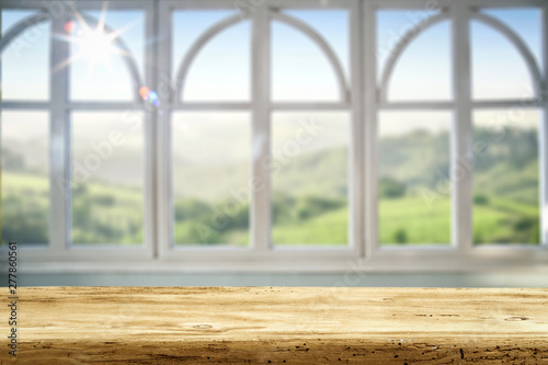 Desk of free space and summer window background 