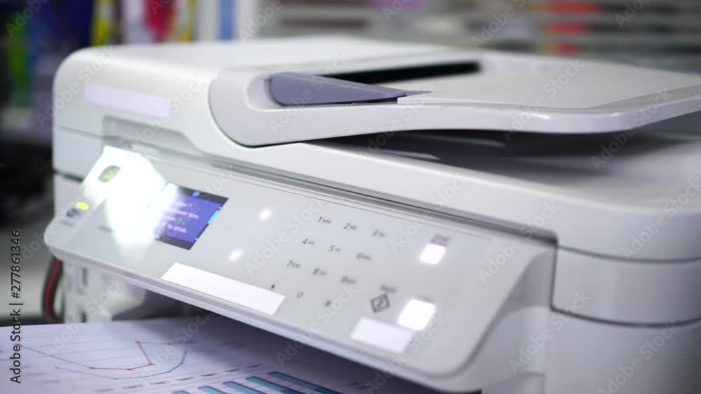 Documents printing concept : Business man hand pressing button machine supplies in control panel laser printer for copy scanner and printing document report graph chart in busy office Documents printing concept : Business man hand pressing button machine supplies in control panel laser printer for copy scanner and printing document report graph chart in busy office