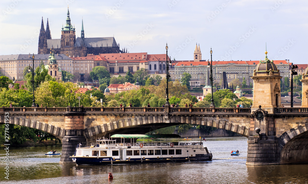 Prague, Czech Republic skyline with historic Charles Bridge. Boat cruise on Vltava river