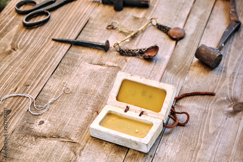 Set and shape of wax to create coins in ancient times. Making old coins from silver by stamping. Reconstruction tools for creating vintage money. photo