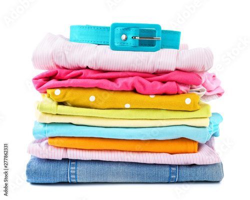 Stack of folded colorful clothes for children and teens.