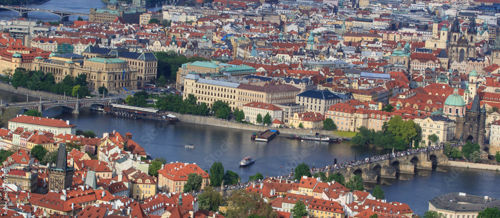 Top view of the old beautiful city with the river and bridges. Prague