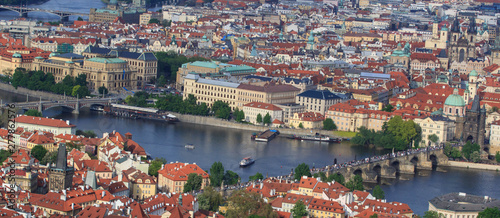 Top view of the old beautiful city with the river and bridges. Prague