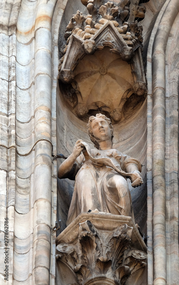 Obraz premium Statue of Saint on the facade of the Milan Cathedral, Duomo di Santa Maria Nascente, Milan, Lombardy, Italy