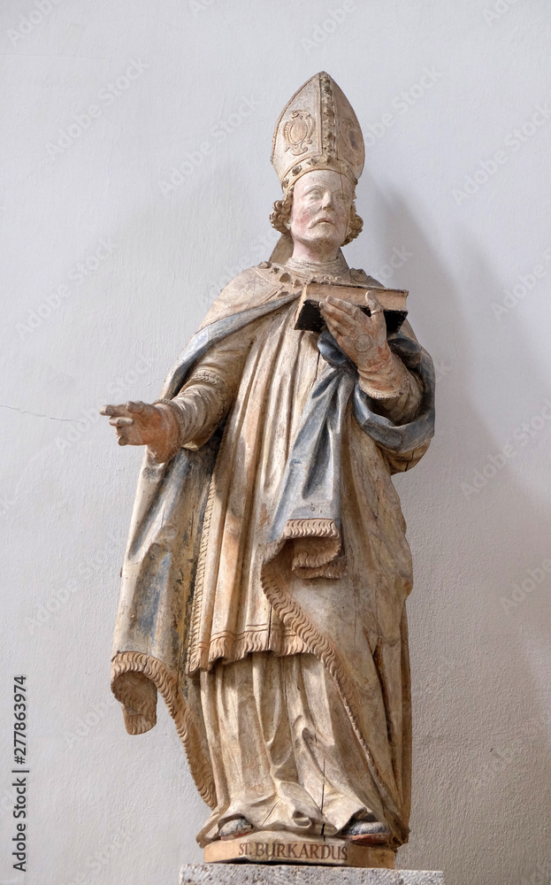 Obraz premium Saint Burchard of Wurzburg, statue in Neumunster Collegiate Church in Wurzburg, Germany