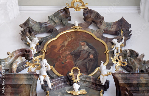 Blessed Elizabeth of Reute receiving the sacred stigmata, altarpiece on the altar of the Holy Rosary in the Saint Martin church in Unteressendorf, Germany photo