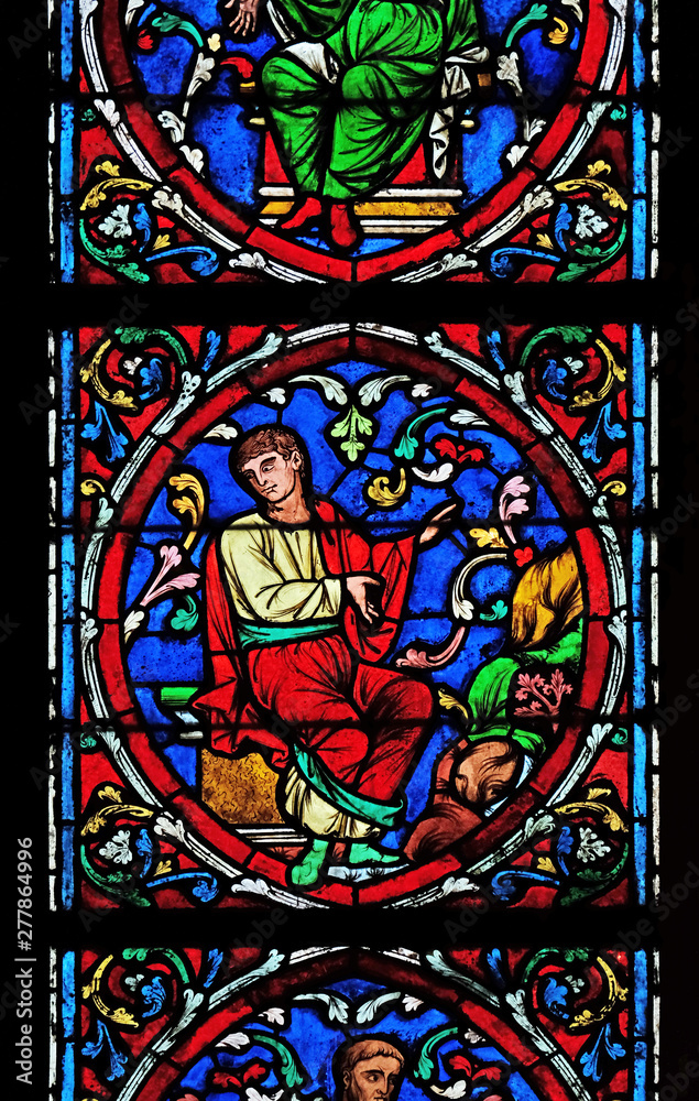 Colorful stained glass window in the Notre Dame Cathedral, UNESCO World Heritage Site in Paris, France 