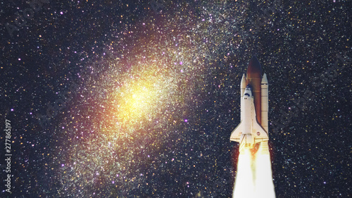 Fototapeta Naklejka Na Ścianę i Meble -  Space shuttle with galaxy. Elements of this image furnished by NASA