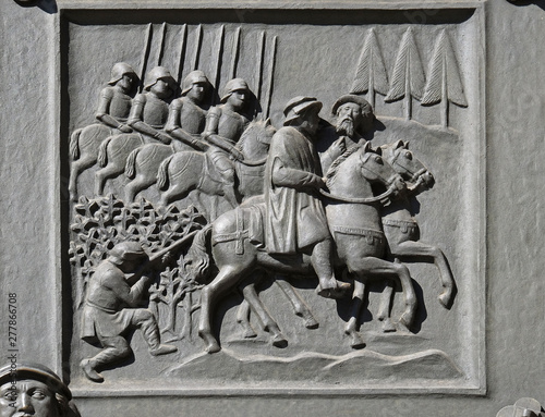 Zwingli riding on the side of the mayor Diethelm Rois to the disputation in Bern, relief on the door of the Grossmunster (