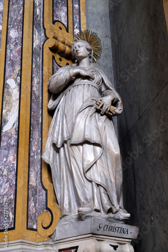 Saint Christina statue on the altar in the Cathedral of Santa Maria Assunta i San Cassiano in Bressanone, Italy photo