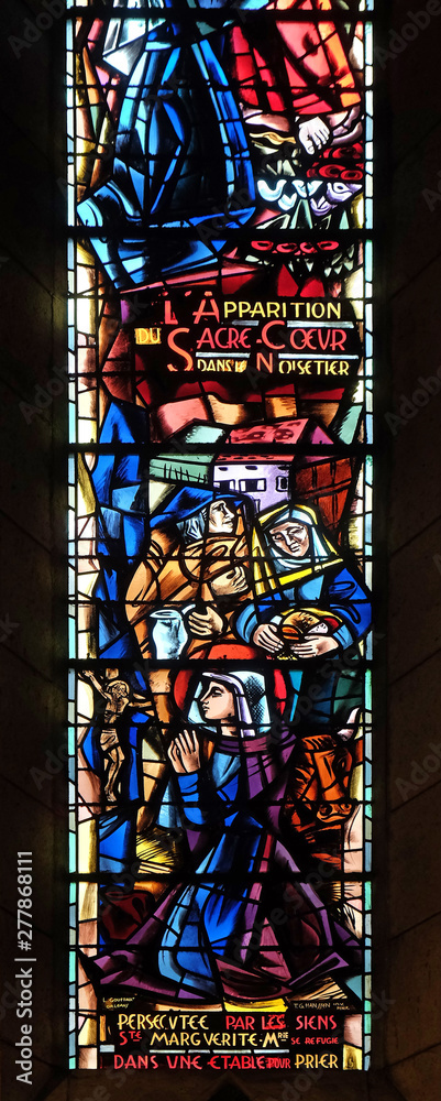 Scenes from the life of Saint Margaret Mary Alacoque, stained glass window in Basilica of the Sacre Coeur, dedicated to the Sacred Heart of Jesus in Paris, France 
