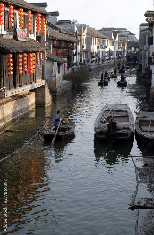 Tourist boats on the water canals of Xitang Town in Zhejiang Province, China