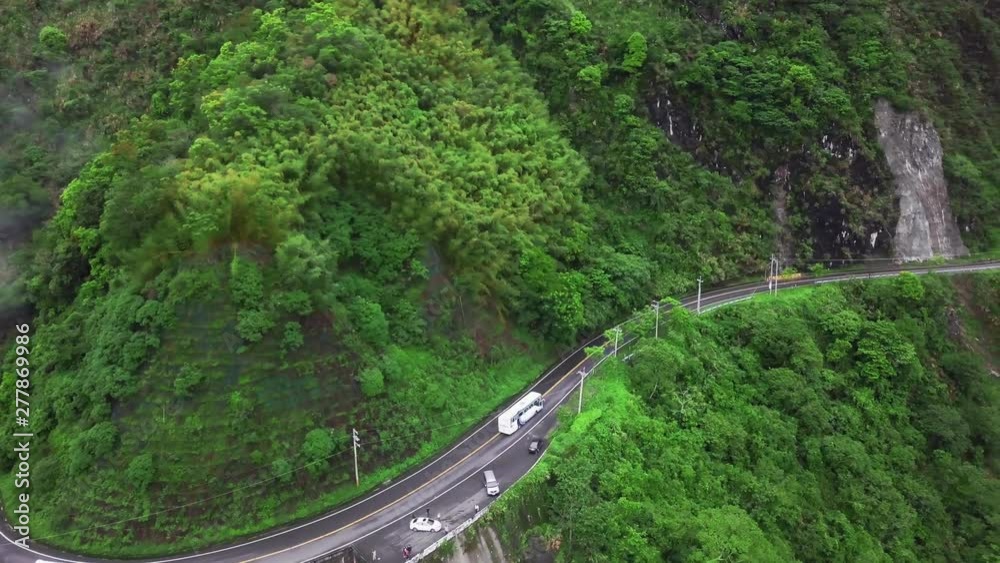 Transport Moving along Winding Curved Serpentine Mountain Road in Taroko Gorge National Park in Taiwan. Aerial View
