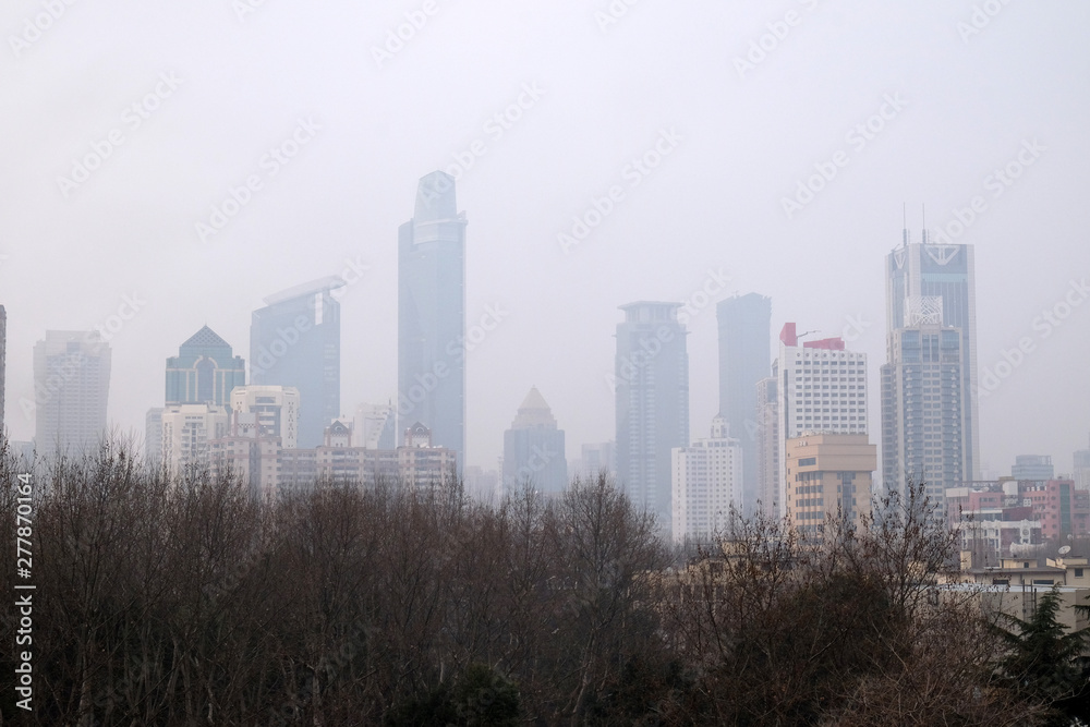 Shanghai city at morning in foggy day, China