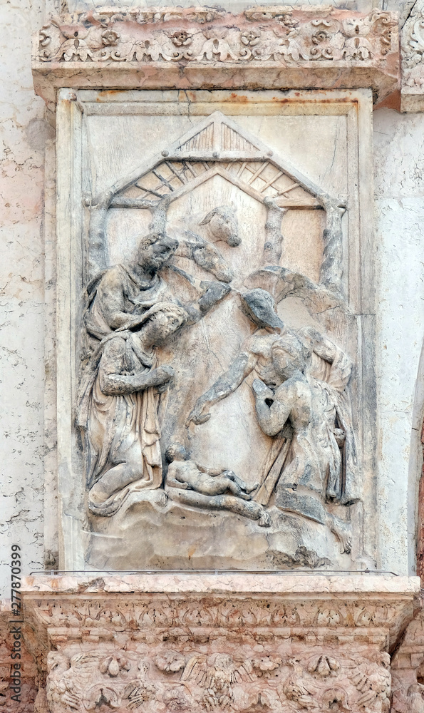 Nativity, Birth of Jesus, panel on the left door of San Petronio Basilica in Bologna, Italy