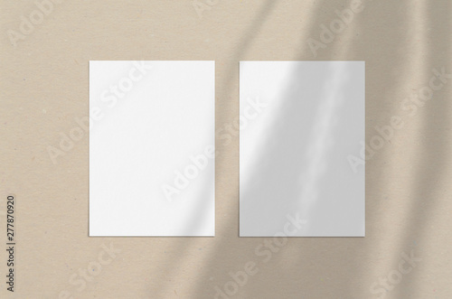 Blank white vertical paper sheet 5x7 inches with shadow overlay. Modern and stylish greeting card or wedding invitation mock up.