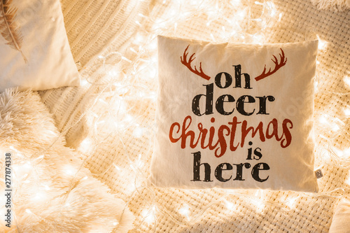 decorative pillow with an inscription in the lights. concept for Christmas, New Year