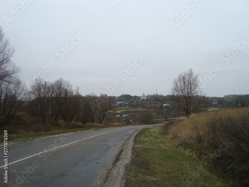 On a cloudy day, the old highway runs through the countryside.