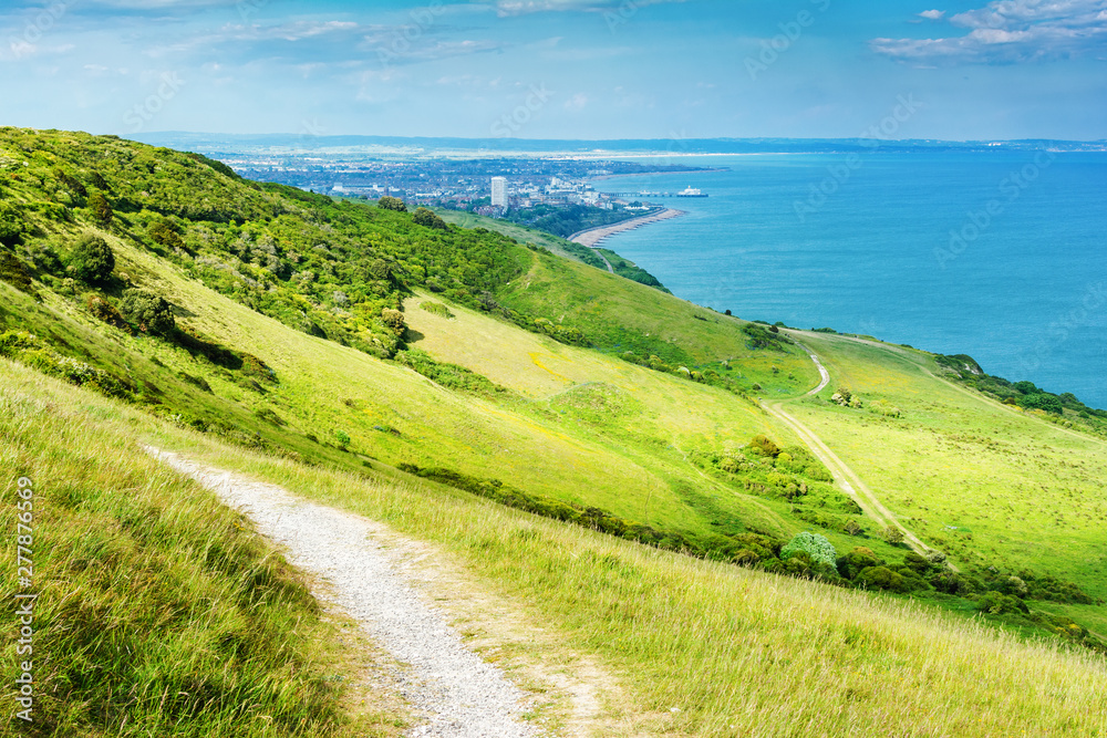 Naklejka premium View of Eastbourne town from beachy head, East Sussex, England. View of the sea, beach, houses, selective focus