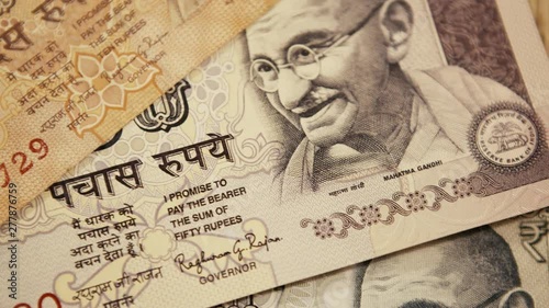 Wallpaper Mural Rupee Banknotes. Smooth Pan to the Right. 4k Video Torontodigital.ca