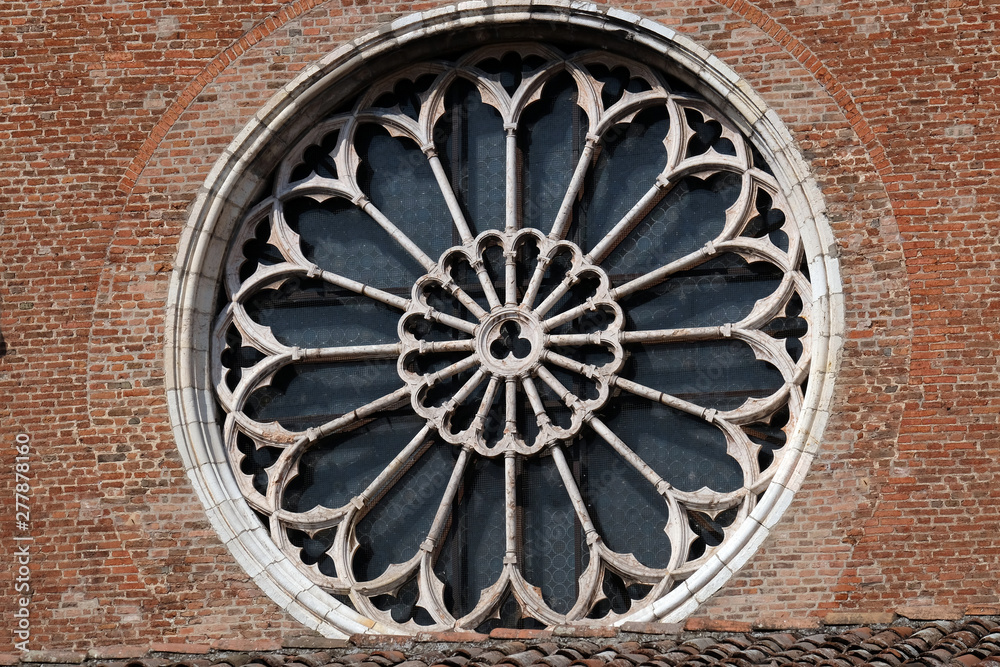 Rose window on Saint Francis church in Mantua, Italy 