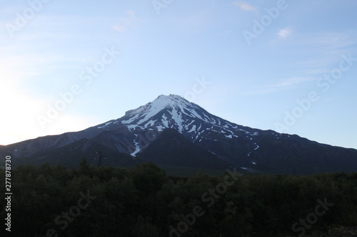 The top of the volcano in Kamchatka is shrouded in vapors, a beautiful mountain landscape.