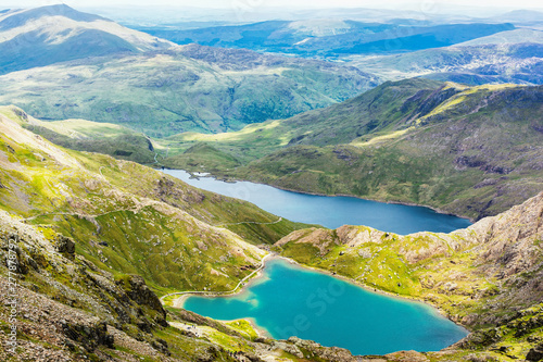 Fototapeta Naklejka Na Ścianę i Meble -  View of beautiful blue lakes in Snowdonia National Park, North Wales, mountains on the back, selective focus