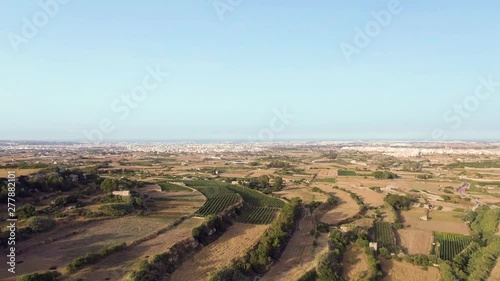 Low-level aerial video of the terraced Buskette Fields near the Verdala Castle, Malta, photo