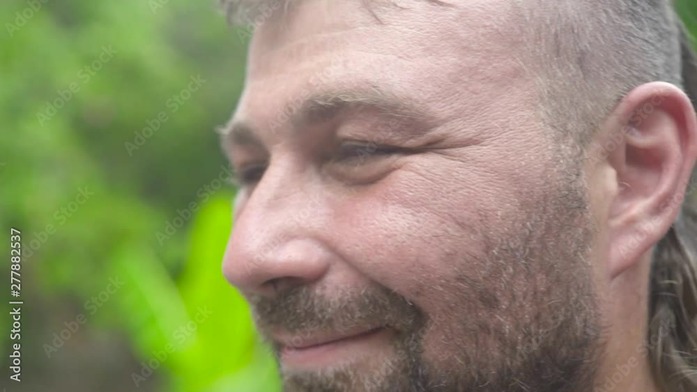 Close up face handsome bearded man looking to camera and smiling. Portrait adult man with bristly face. Close up face handsome bearded man looking to camera and smiling. Portrait adult man with bristly face.